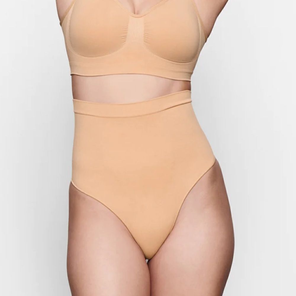SKIMS Seamless Sculpt Mid Waist Thong In Ochre Nude Shaping Shapewear